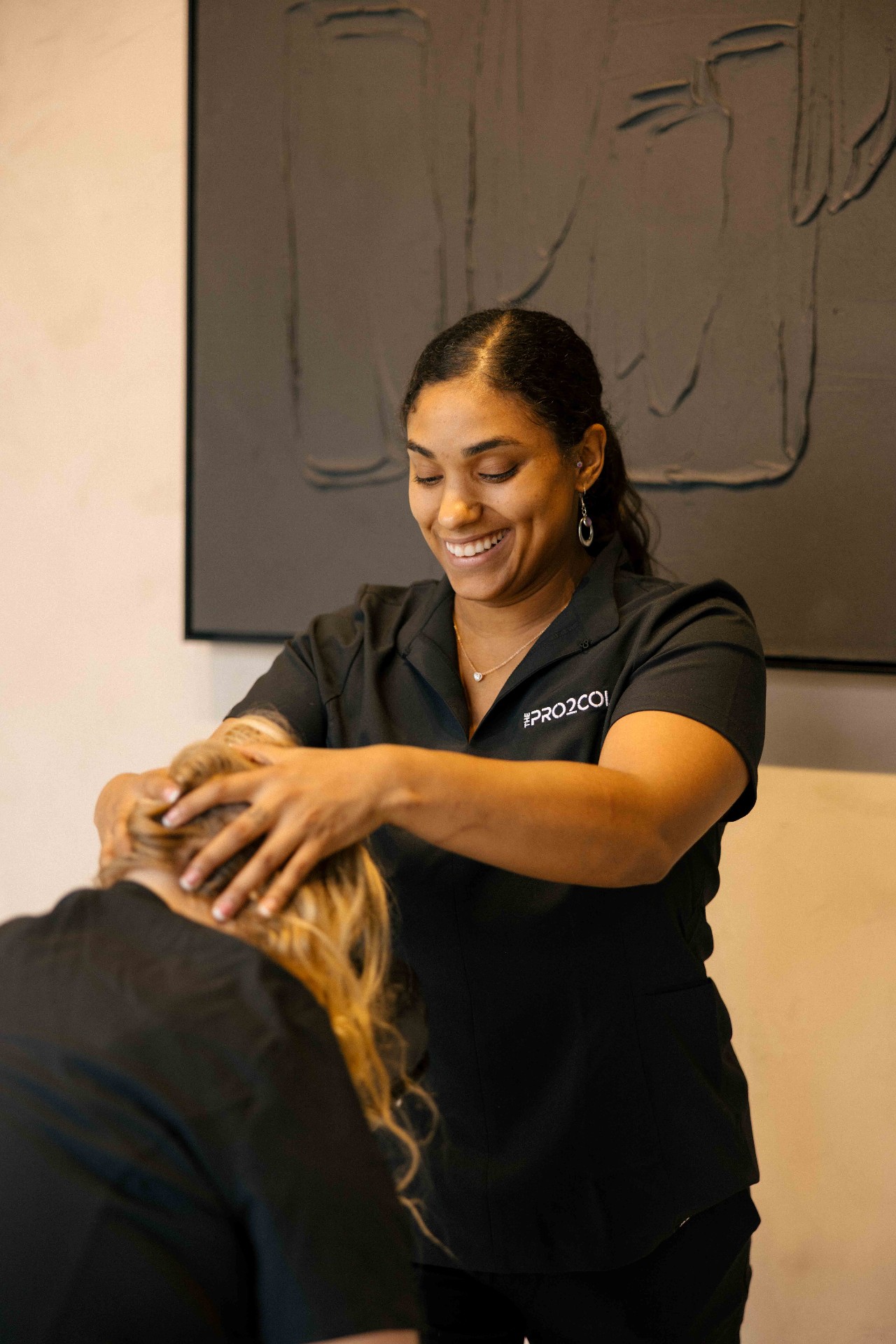 Pro2col practitioner providing bodywork treatment